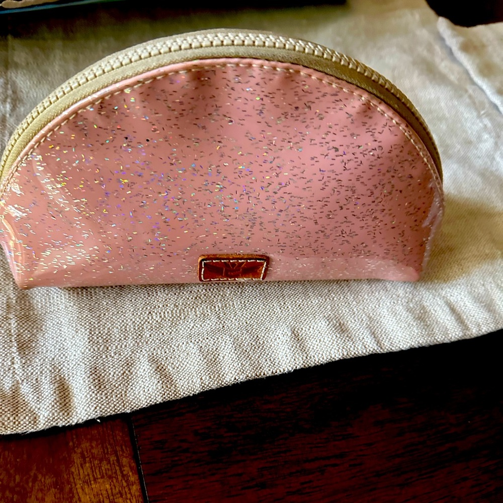 Consuela small make-up bag. Sparkly pink outside—cactus pattern inside